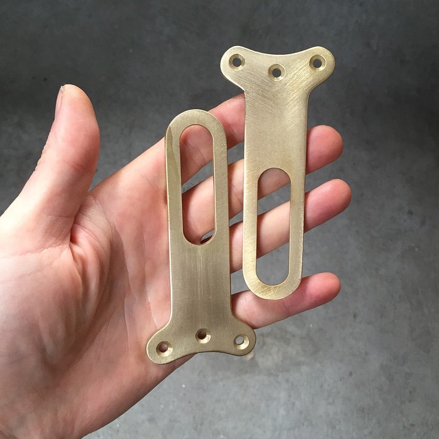 Little hand machined brass slide levers for the shoulder mechanism in my new piece.